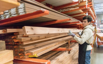 mature man Working at a timber/lumber warehouse